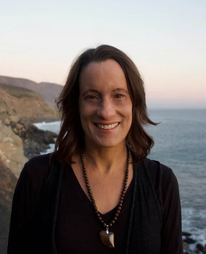 Cindy Costley standing on the coast
